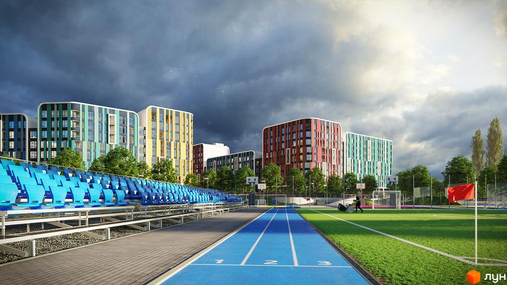 Багатоповерхові будинки Житлового комплексу Respublika з кольоровими фасадами, оточені спортивними майданчиками, біговою доріжкою та футбольним полем.