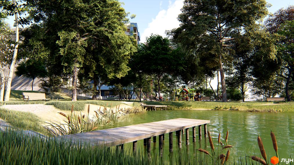 Житловий комплекс LakePark з озером та пірсом. На території є дитячий майданчик, лавки та зелені насадження.