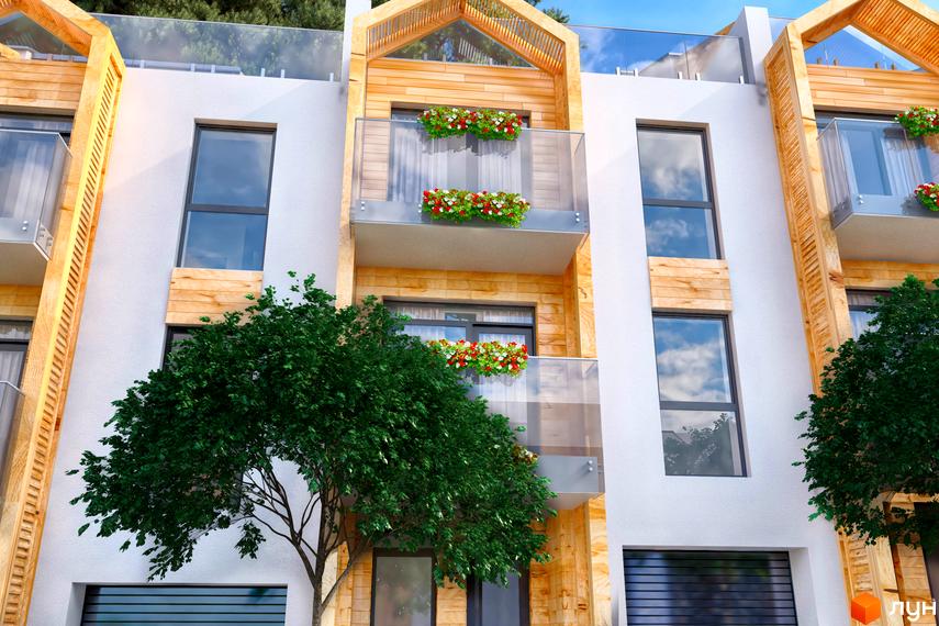 Житловий комплекс Royal Estate: фасади будинків з дерев'яними елементами, скляними балконами та квітами. Навколо зелені дерева та блакитне небо.