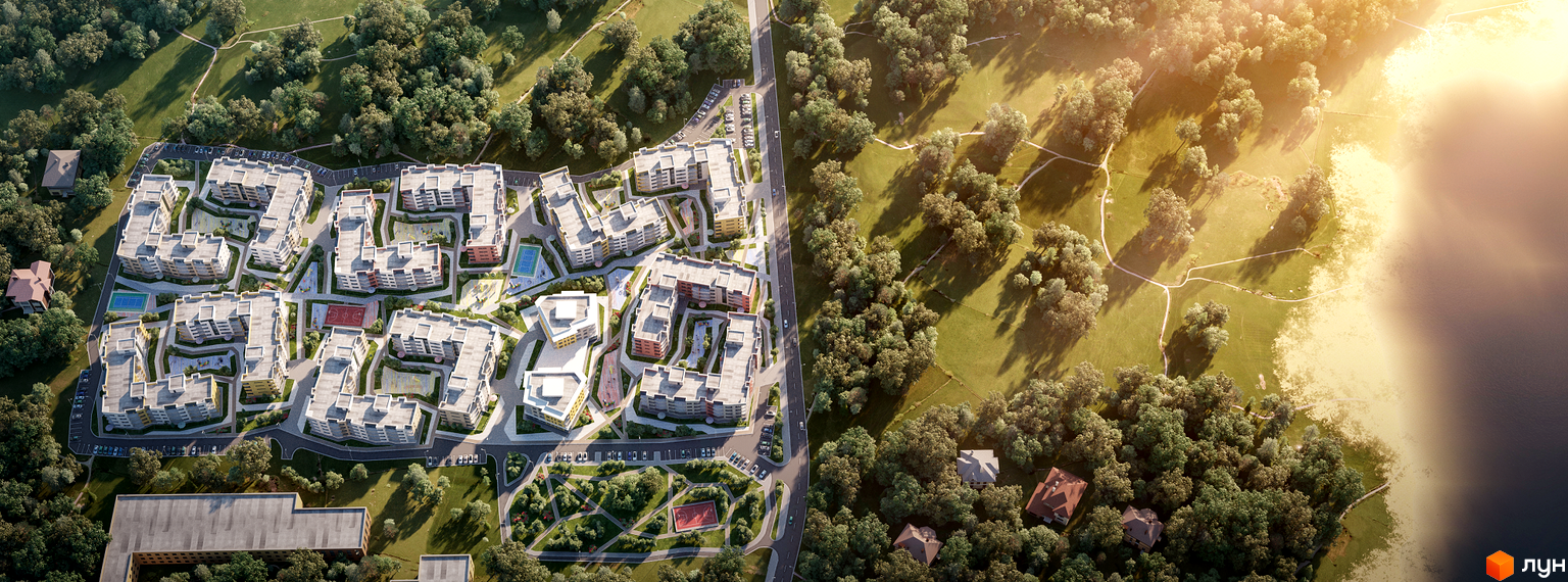 Аерофотозйомка житлового комплексу Італійський квартал з багаторівневими будинками, спортивними майданчиками та зеленими зонами. Комплекс розташований біля озера та лісу.