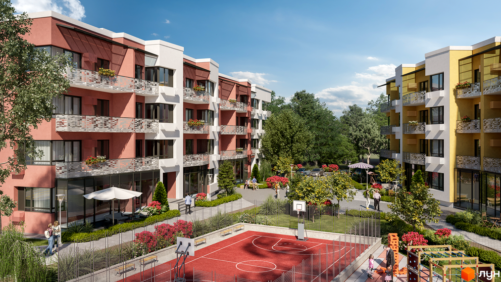 Житловий комплекс Італійський квартал з червоним баскетбольним майданчиком та дитячим майданчиком. Будинки мають рожеві та жовті фасади з балконами.