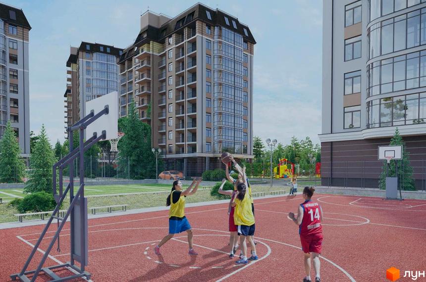 Житловий комплекс Жуляни. Високоповерхові будинки з балконами та панорамними вікнами. На території спортивний майданчик з баскетбольним кільцем.