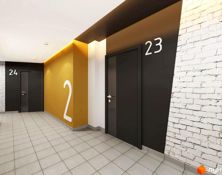 Вхідна група житлового комплексу Роланд з дверима та номерами 23 і 24. Оздоблення стін жовтою фарбою та білою цеглою.