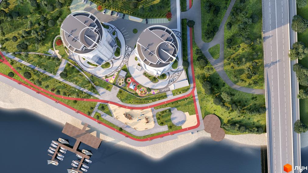 Вид зверху на будівлі житлового комплексу Сонячна Рів'єра. На території комплексу є дитячий майданчик, набережна та причал для човнів.