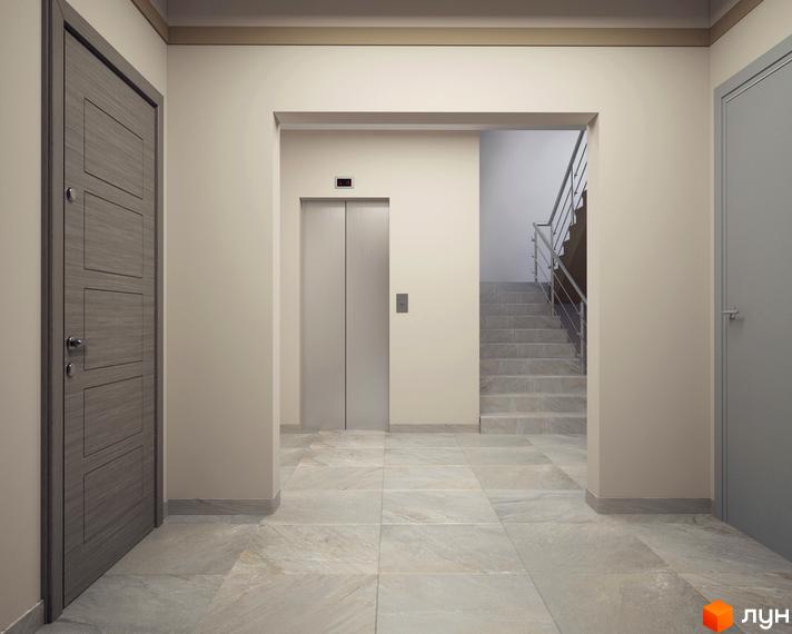 Інтер'єр холу в ЖК Цитадель-2. Світлі стіни, ліфт, сходи та плитка на підлозі створюють відчуття простору.