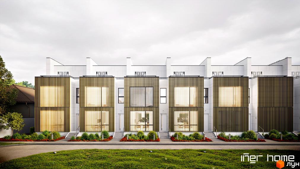 Ряд білих таунхаусів Iner Home з дерев'яними вертикальними ламелями на фасадах. Перед будинками зелений газон, доріжка та доглянуті насадження.
