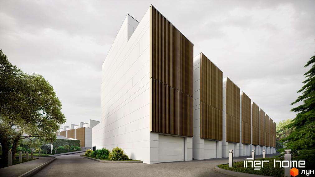 Зображення сторінки житлового комплексу Iner Home. Білі будинки з дерев'яними панелями та гаражами. На території є дерева, кущі та асфальтована дорога.