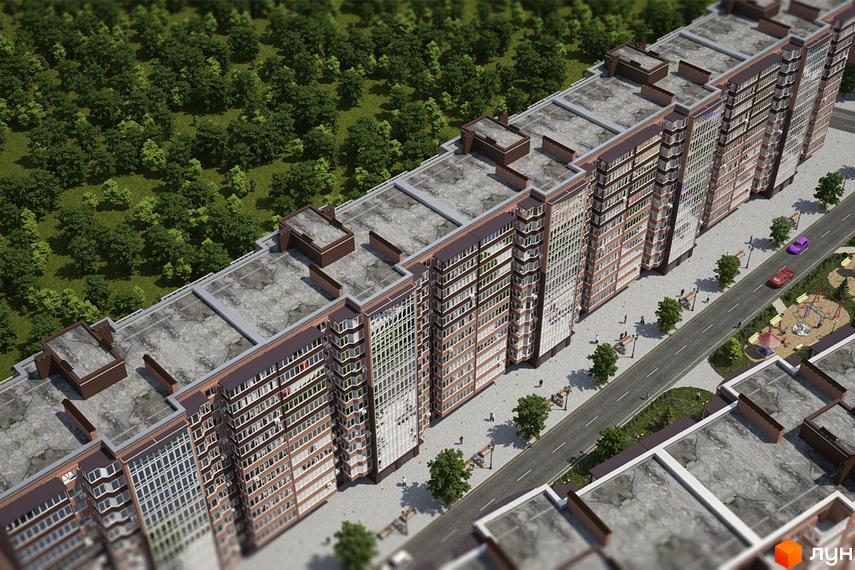 Житловий комплекс Мирний: вид зверху на багатосекційний будинок з коричневими фасадами, дорогу, зелені насадження та дитячий майданчик.