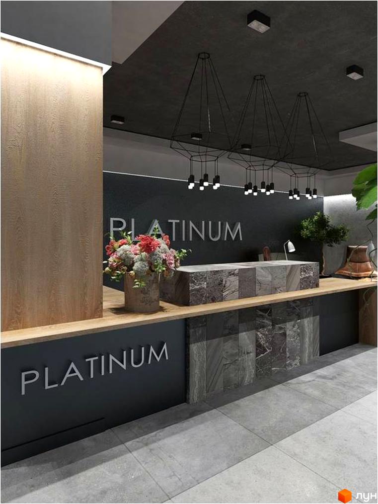 Ресепшн у Житловому комплексі Platinum Residence. Стійка з назвою комплексу, оздоблена каменем, та букет квітів.
