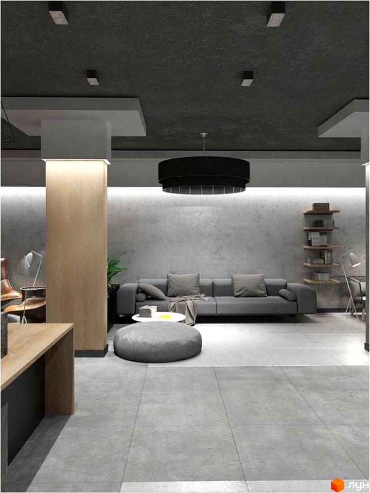 Інтер'єр кімнати в Житловому комплексі Platinum Residence: сірий диван, чорна люстра та дерев'яна колона. Стіни пофарбовані у сірий колір.