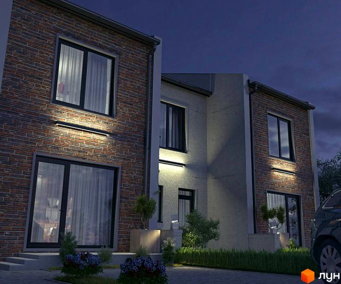 Зображення фасаду будинку в Котеджному містечку LightHouse вночі. На фото видно цегляну кладку, великі вікна та освітлення на стінах.