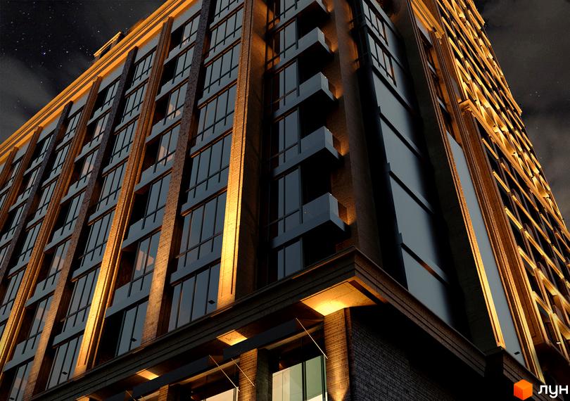 Житловий комплекс CRYSTAL RESIDENCE. Зовнішній вигляд будівлі з цегляним фасадом та підсвічуванням.