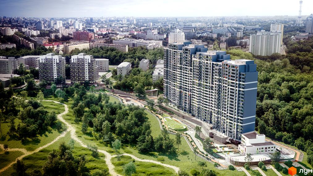 Житловий комплекс Кирилівський Гай: висотні будинки сіро-білого кольору з синіми елементами, оточені зеленим парком з доріжками та облаштованою територією.
