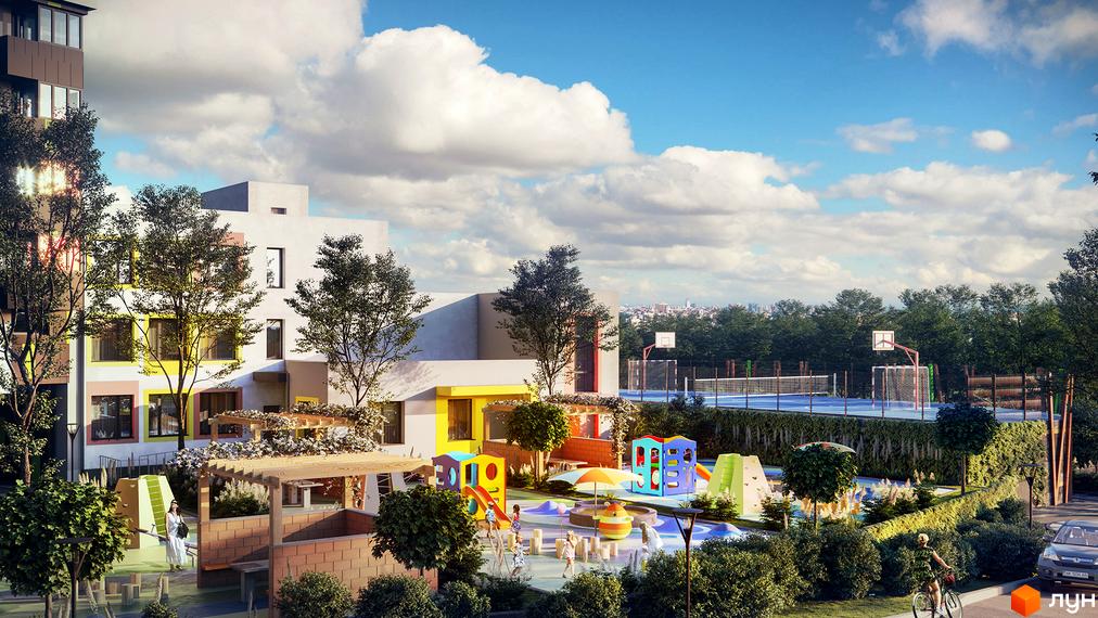 Комплекс Кирилівський Гай: будинки з білими та кольоровими фасадами, великий дитячий майданчик та спортивні поля серед зелені.