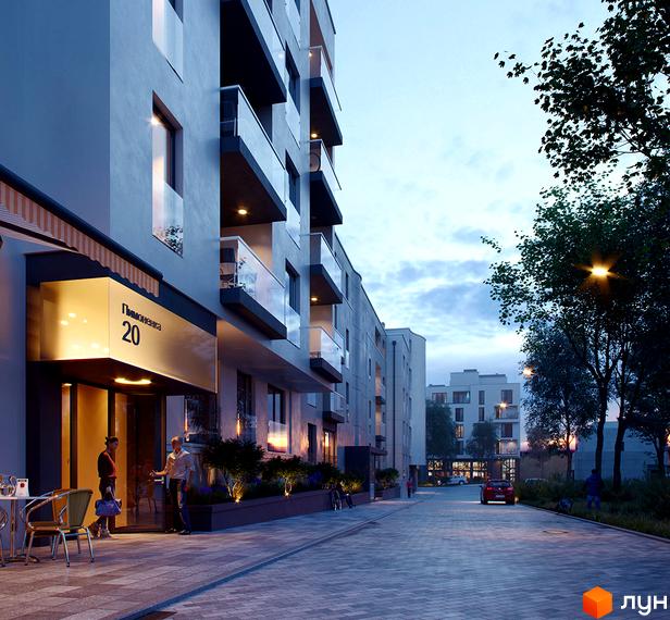 Зовнішній вигляд новобудови ЖК Villa Magnolia Spring з фасадом сірого кольору та скляними балконами. Прибудинкова територія освітлена ліхтарями ввечері.