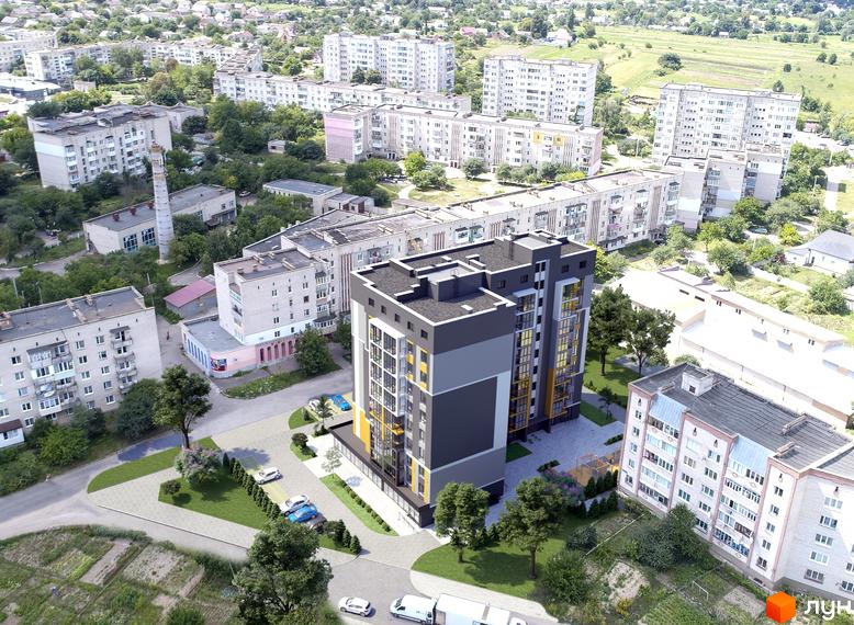 Зовнішній вигляд новобудови ЖК Рідне Місто з сірими та жовтими вставками. Навколо будинку облаштована прибудинкова територія з парковкою та зеленими насадженнями.