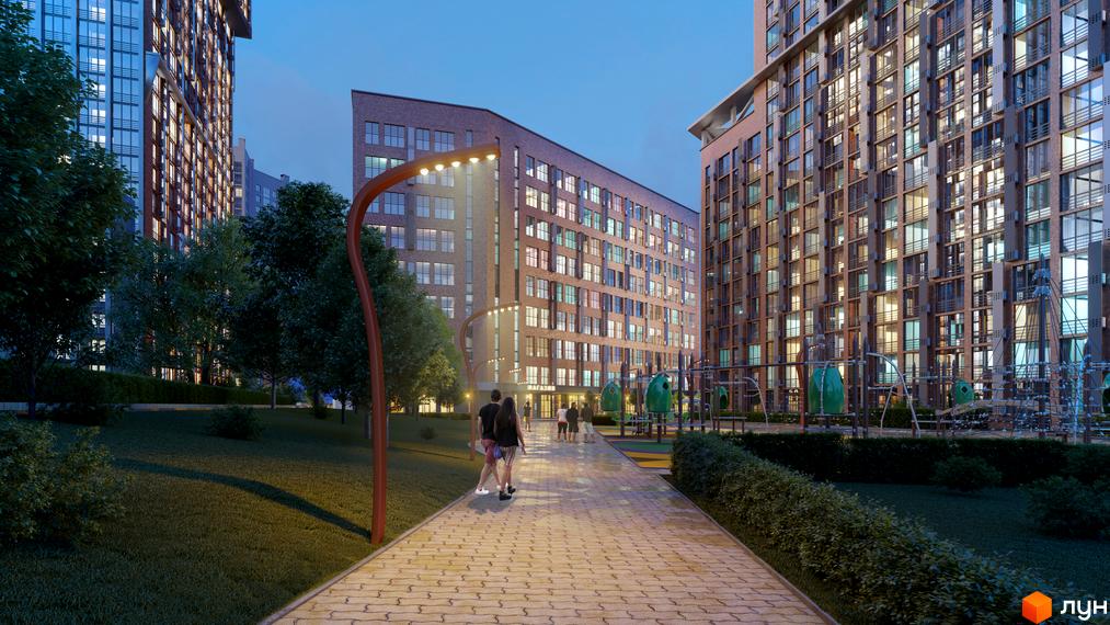 Житловий комплекс SOLAR CITY. Високі будинки з цегляними фасадами, освітлена алея та доглянута прибудинкова територія.