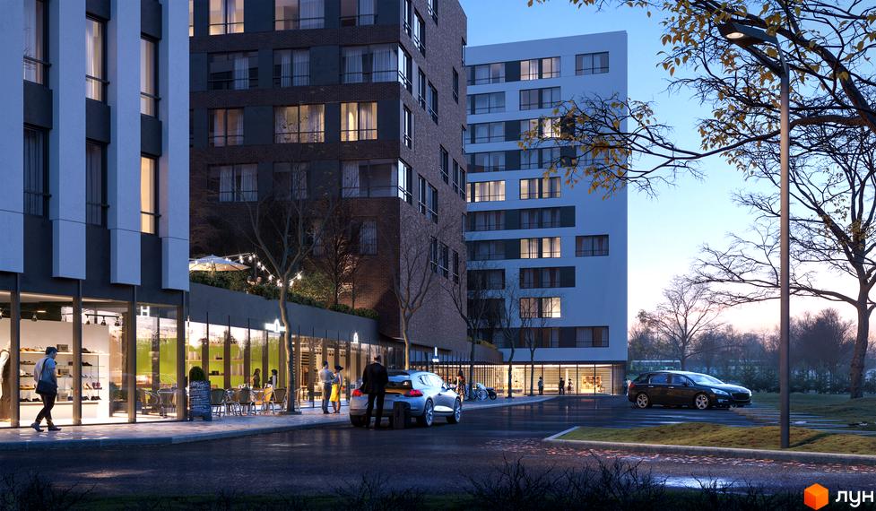 Зображення фасаду Greenville Park Lviv. Житловий район з магазинами на першому поверсі та припаркованими автомобілями.