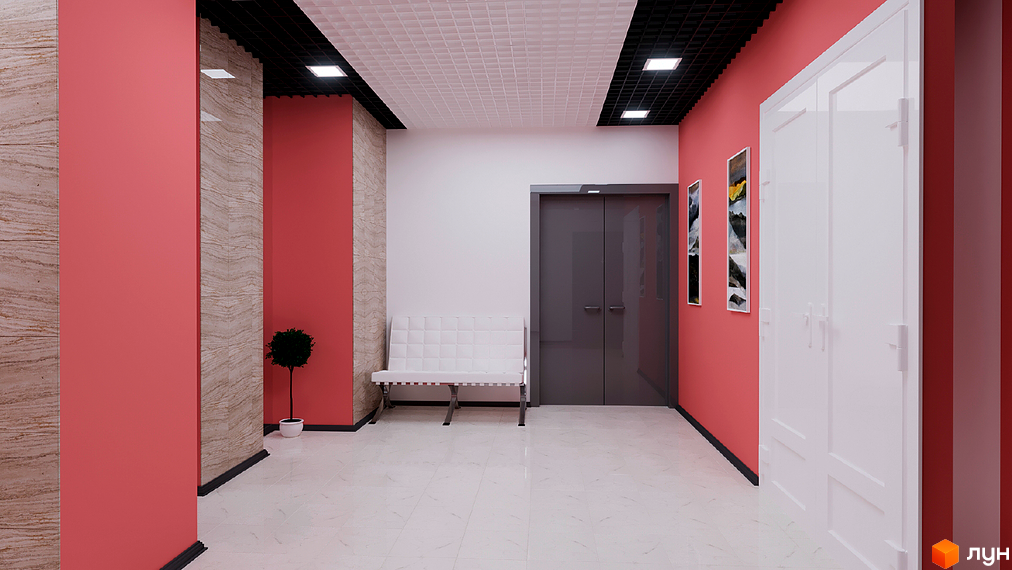 Інтер'єр холу в ЖК Гармонія. Світлий коридор з білою лавою, рожевими стінами та сірими дверима. На стінах картини, а на підлозі плитка.