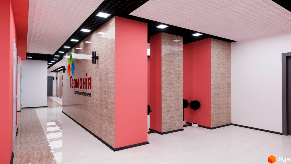 Житловий комплекс Гармонія. Просторий коридор з оздобленням з каменю та рожевими колонами. На стіні вивіска з назвою ЖК.