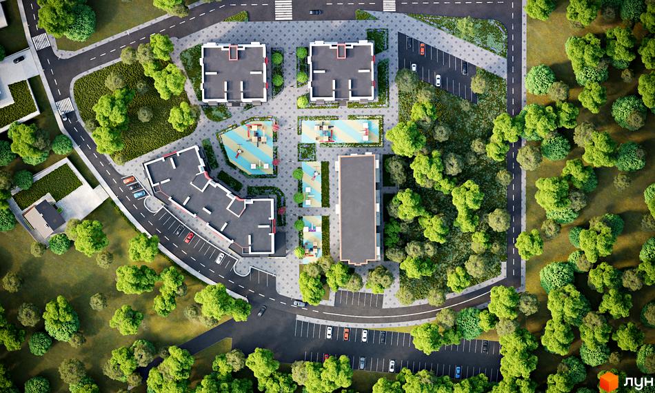 Вид зверху на житловий комплекс Рідний з сучасними будинками та упорядкованою прибудинковою територією з дитячими майданчиками та зеленими зонами. Парковка та дороги забезпечують зручний доступ до будинків.