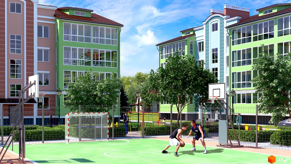 Житловий комплекс Ріо з різнокольоровими багатоповерховими будинками та облаштованим двором з баскетбольним майданчиком і футбольними воротами.