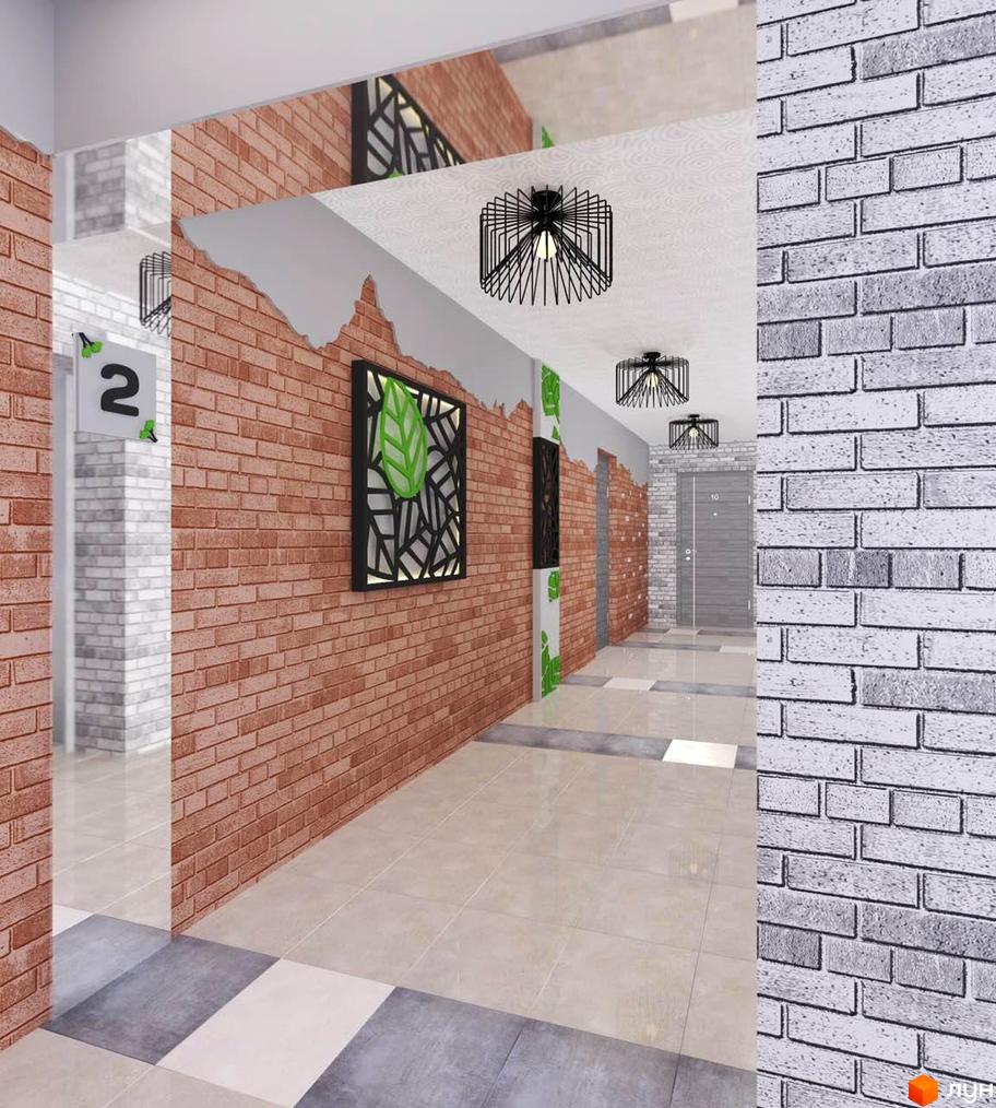 Інтер'єр холу новобудови ЖК Гармонія-2 з цегляною стіною та декоративним панно. Сучасне освітлення та плитка на підлозі створюють затишну атмосферу.