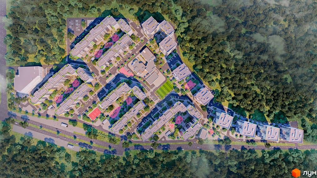 Житловий комплекс Чарівне Місто - вид згори на багатоквартирні будинки з дитячими майданчиками та спортивними зонами. Навколо комплексу зелені насадження та дорога з автомобілями.