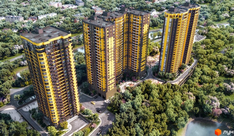 Житловий комплекс Медовий-2: три високі жовто-коричневі новобудови оточені зеленню та водоймою. На території комплексу є дороги, паркування та дитячі майданчики.