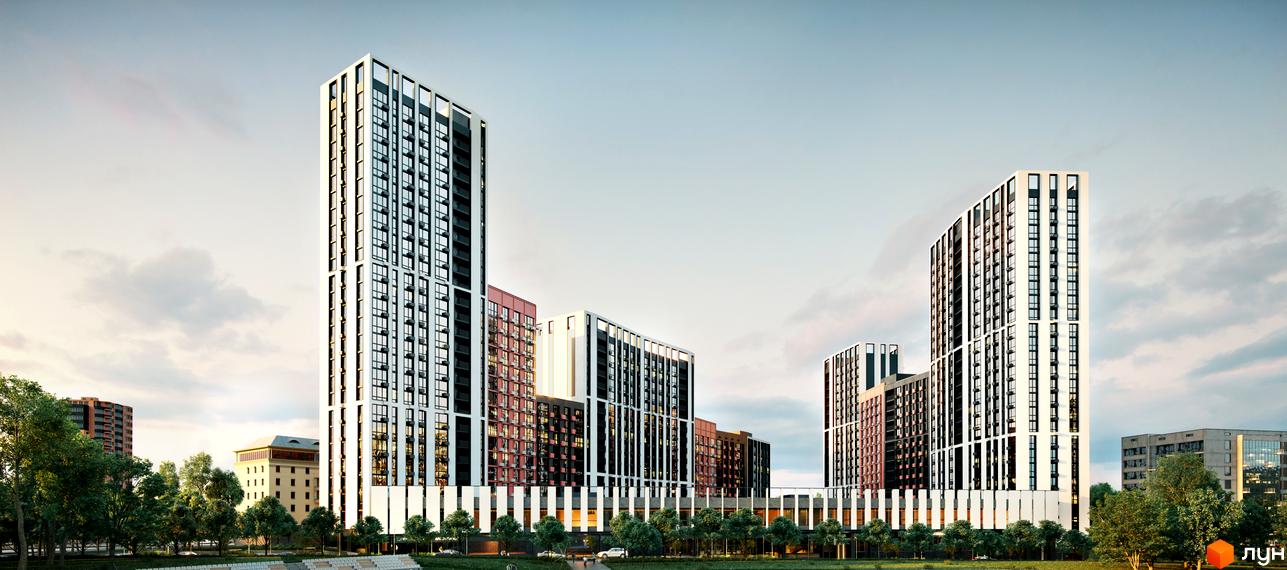 Зображення житлового району Start. Вигляд на багатоповерхові будинки з великими вікнами та білим оздобленням, перед якими розташована зелена зона з деревами.