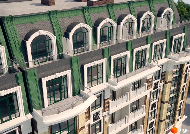 Фасад Житлового комплексу на Єврейській з зеленим мансардним дахом та арковими вікнами. Видно балкони з металевими поручнями та цегляну обробку стін.