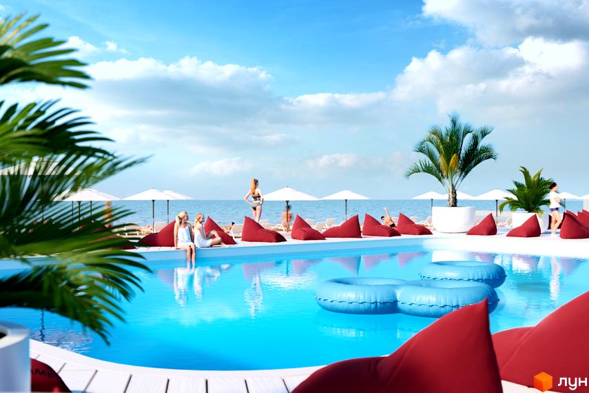 Aura Apart: житловий комплекс з басейном та зоною відпочинку біля моря. Насолоджуйтесь сонцем та релаксом на зручних лежаках.