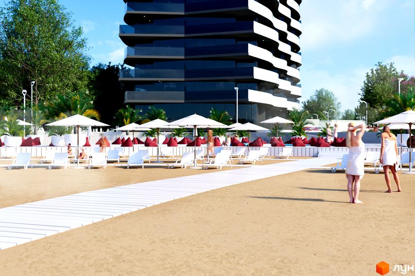 Aura Apart - новобудова з хвилястим фасадом та панорамними вікнами, розташована на першій лінії біля моря з пляжем, шезлонгами та парасольками.