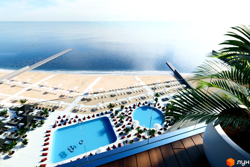 Aura Apart: вид на пляж та басейни з висоти пташиного польоту. Сучасний житловий комплекс біля моря з доглянутою територією та зонами відпочинку.
