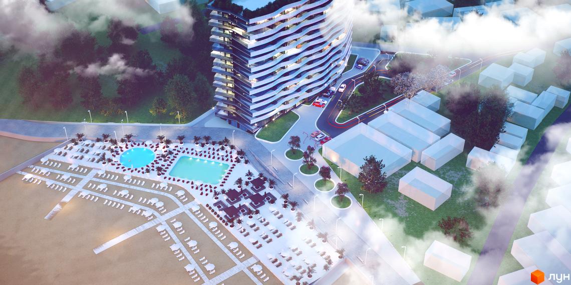 Aura Apart: вид зверху на хвилясту будівлю з балконами та прибудинкову територію з басейном та лежаками.