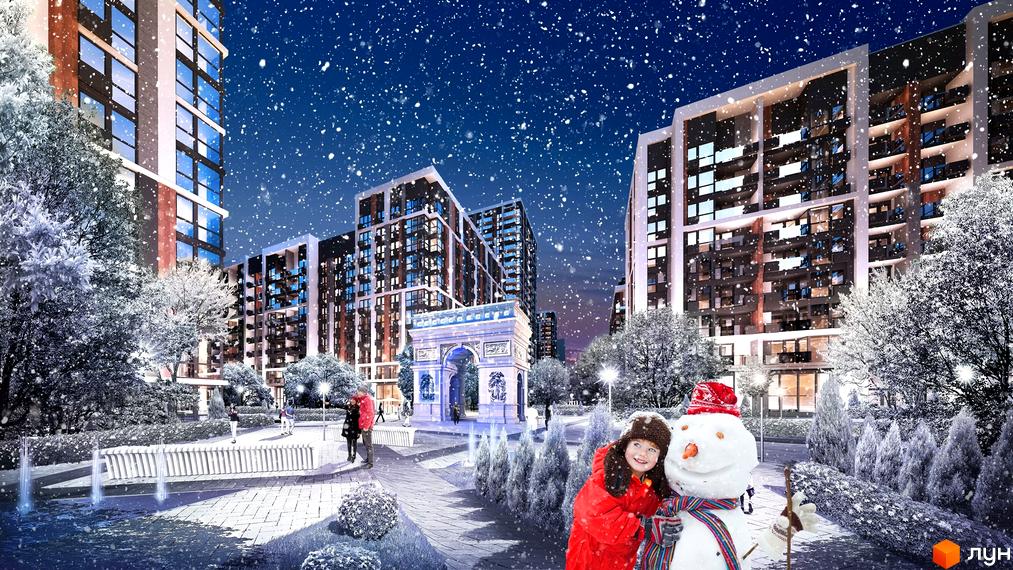 Житловий комплекс Французький квартал 2 взимку. Сучасні будинки та новорічна атмосфера з снігом та сніговиком. Затишна прибудинкова територія з аркою та деревами.