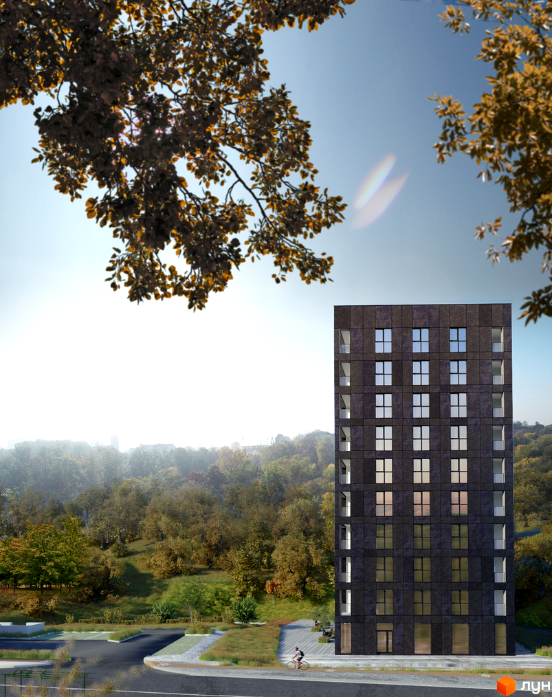 Новобудова Silver Flow з темним фасадом та великими вікнами на фоні осіннього парку. Поруч дорога та зелені насадження.