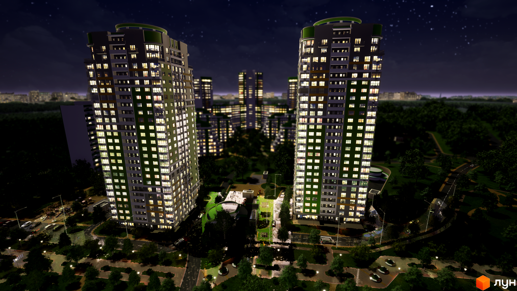 Житловий комплекс Паркове місто вночі, з освітленими вікнами та зеленими фасадами. Прибудинкова територія з деревами, дорогами та освітленням.