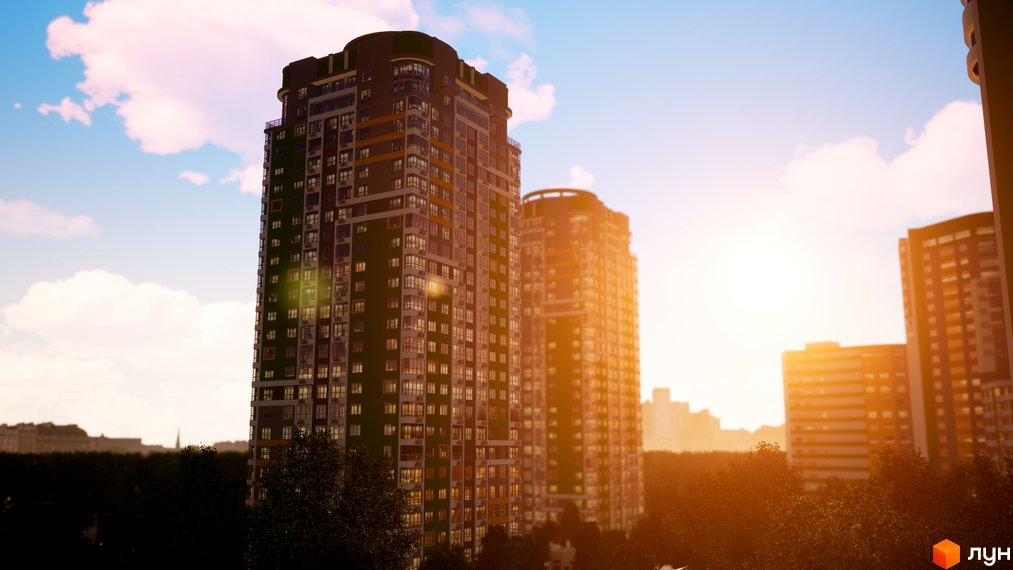 Житловий комплекс Паркове місто: багатоповерхові будинки з темно-сірим та помаранчевим фасадом, оточені зеленими деревами на фоні заходу сонця.