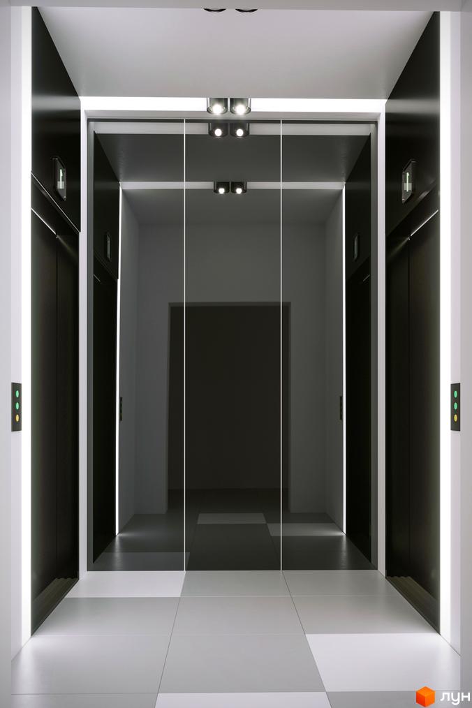 Прохоровський квартал: сучасний вхід до ліфтів з дзеркальними дверима та підсвіткою. Просторий хол з плиткою на підлозі.