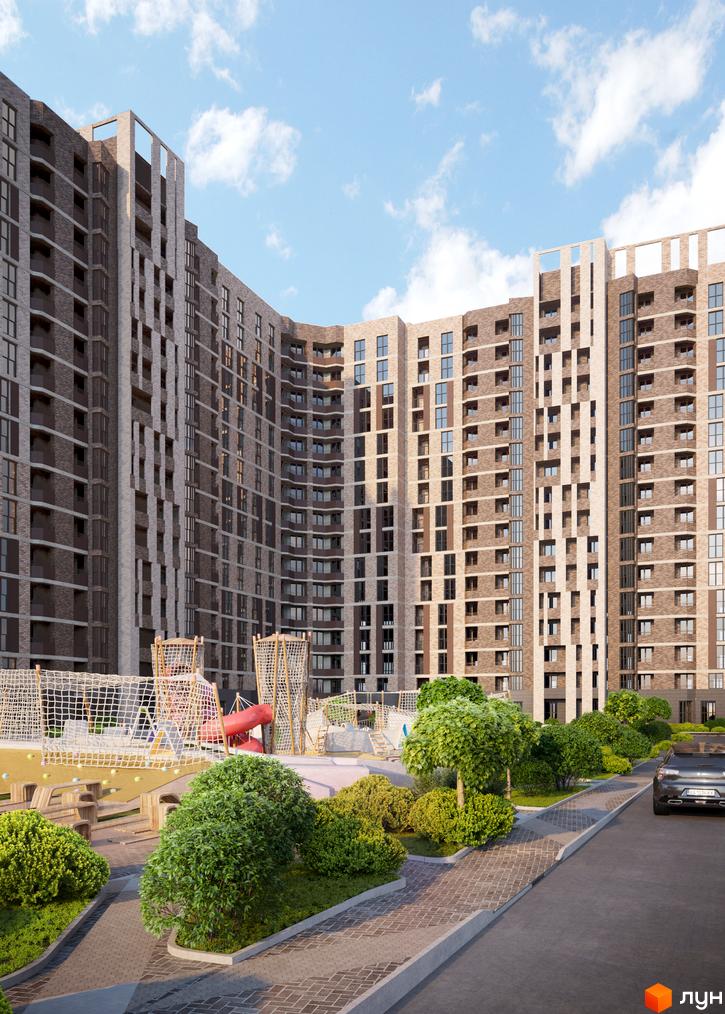 Житловий комплекс Прохоровський квартал з цегляним фасадом та дитячим майданчиком.