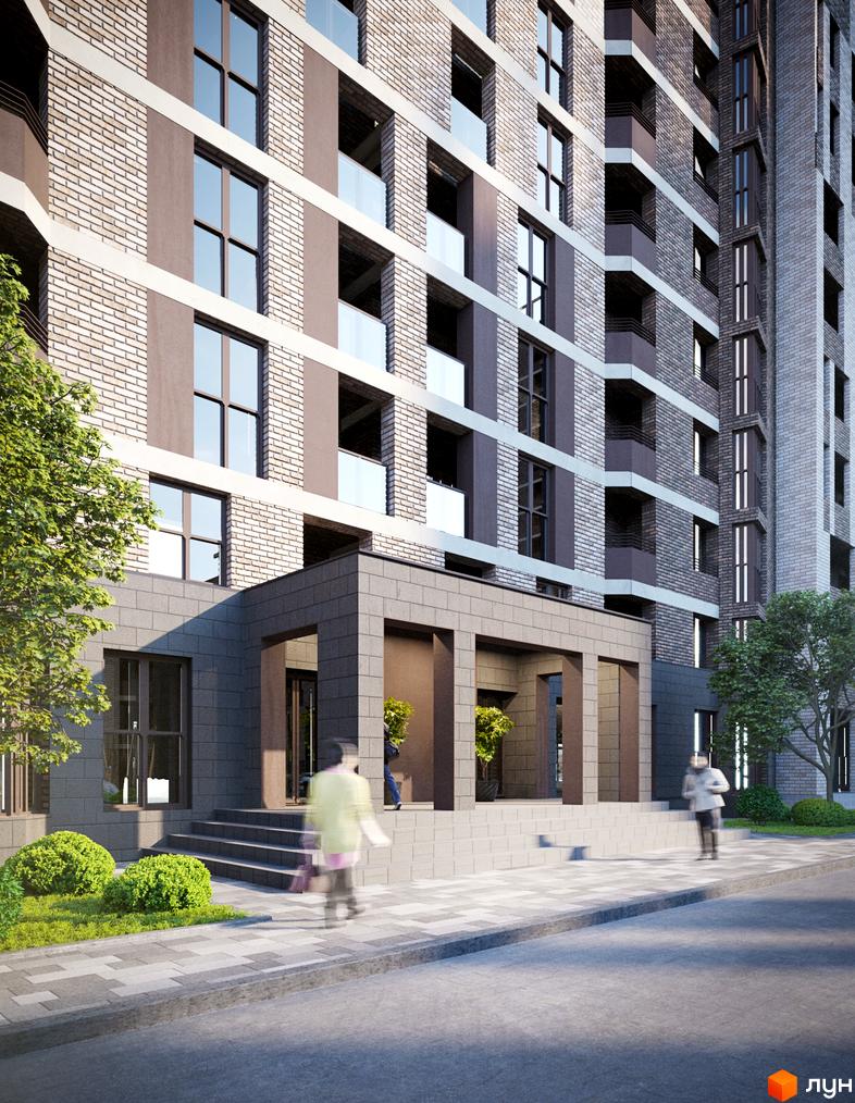 Зовнішній вигляд новобудови Прохоровський квартал з цегляним фасадом та скляними балконами. На прибудинковій території розташовані зелені кущі та тротуар.