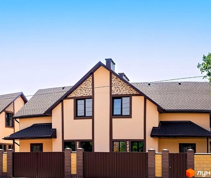 Зовнішній вигляд дуплексу в Котеджному містечку „Баварія“ з коричневою огорожею та цегляними колонами. Дах з сірої черепиці.