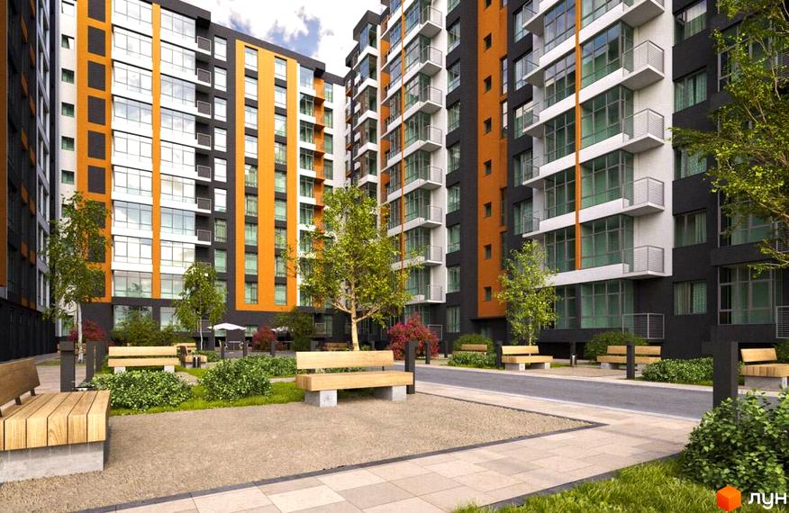 Зображення фасаду та подвір'я Житлового комплексу Comfort City. На фото багатоповерховий будинок з великими вікнами та лавками на прибудинковій території.