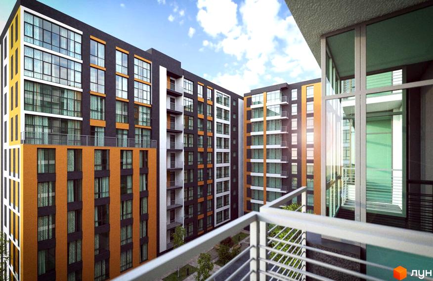 Багатоповерховий будинок житлового комплексу Comfort City з фасадом у чорно-жовтогарячих тонах. На території комплексу висаджені дерева.