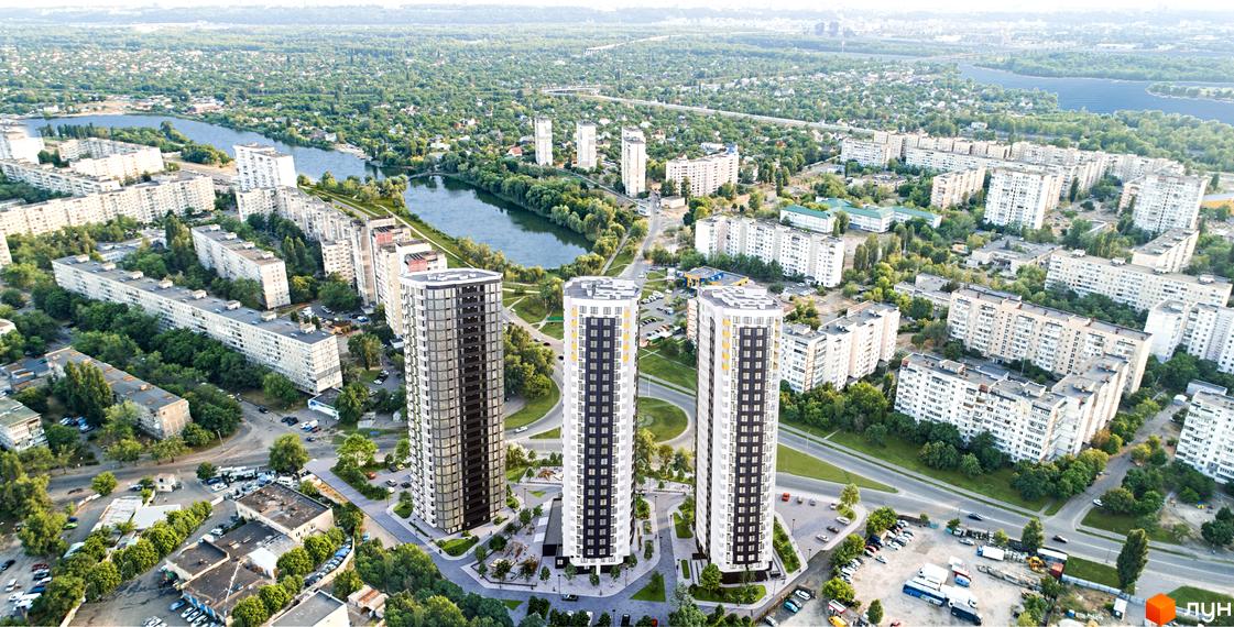 Зовнішній вигляд трьох висотних будинків житлового комплексу Райдужний. Навколо будинків розташована прибудинкова територія з зеленими насадженнями та зонами відпочинку.