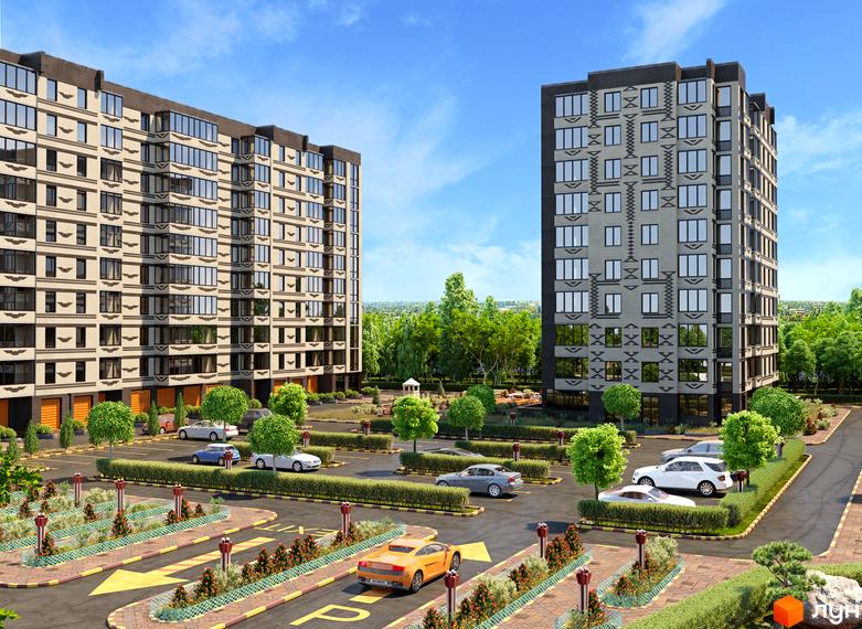 Два багатоповерхові будинки Житлового комплексу Олімпійський з фасадами світлого та сірого кольорів, великими вікнами. Навколо паркінг та озеленена територія.