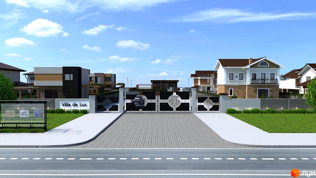 В'їзд до Котеджного містечка Villa de Lux з кованими воротами та будинками з різним дизайном. На території є зелені газони та бруківка.
