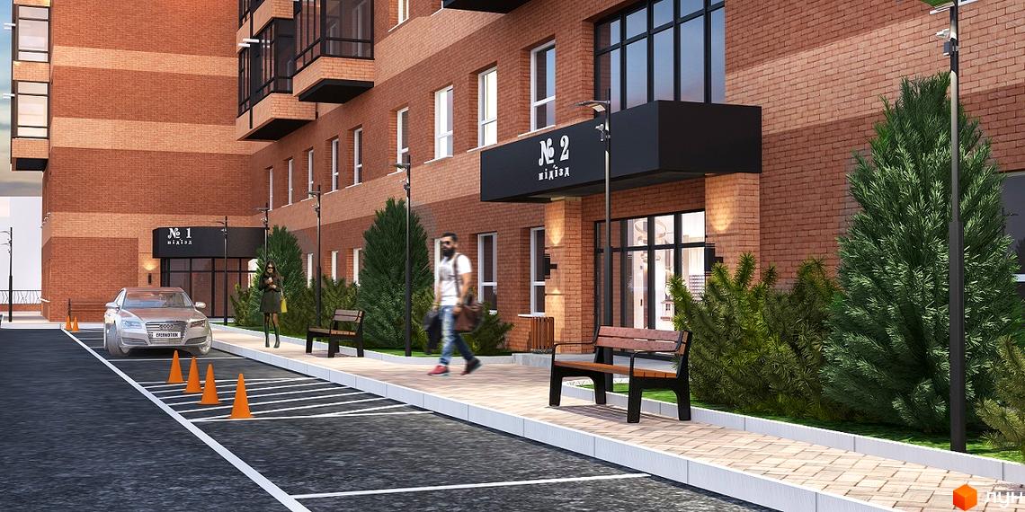 Зовнішній вигляд будинку ЖК Авіатор з цегляною кладкою, вхідною групою та прибудинковою територією з лавками та зеленими насадженнями.