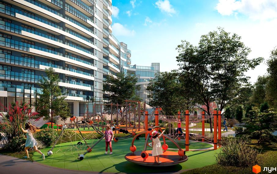 Житловий комплекс Aria з вигнутим фасадом та скляними балконами, поруч дитячий майданчик з ігровими конструкціями та зеленою зоною.